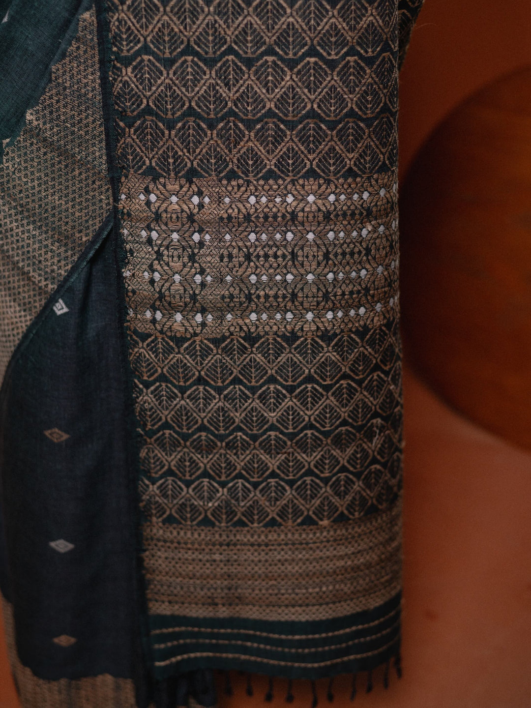 Textile with intricate patterns on a dark background