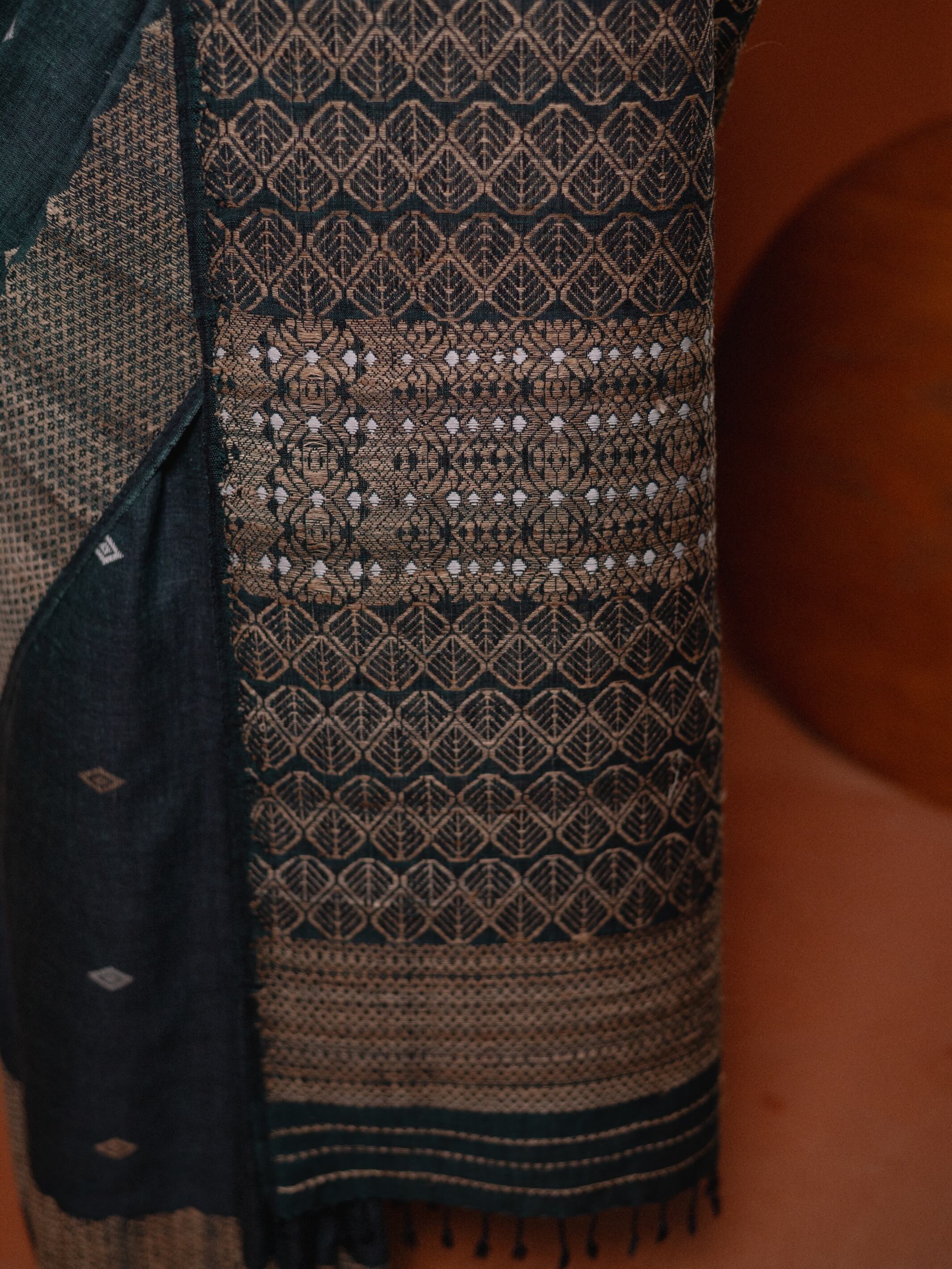 Textile with intricate patterns on a dark background